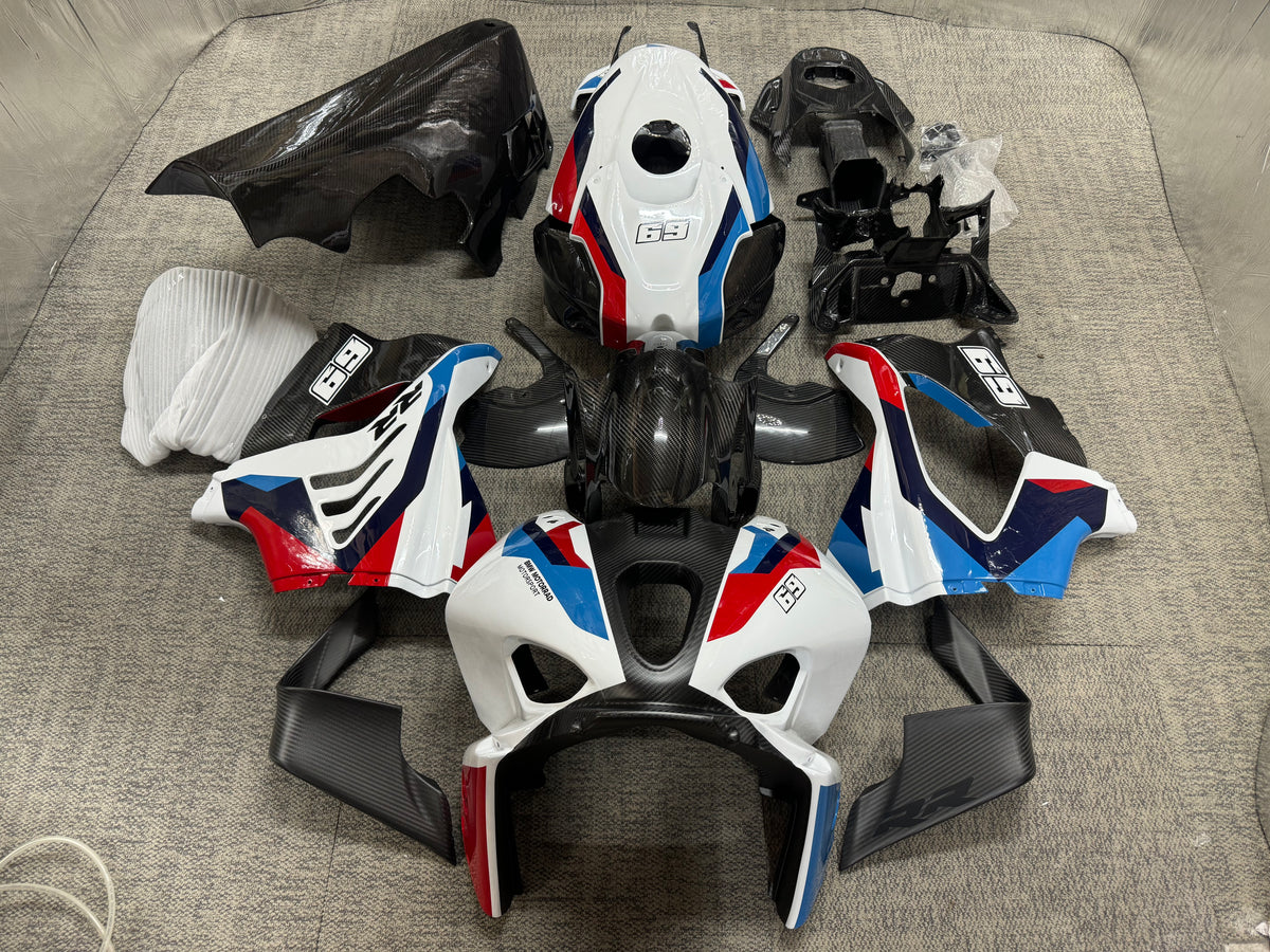 A set of BMW M1000RR carbon fiber fairings in white livery